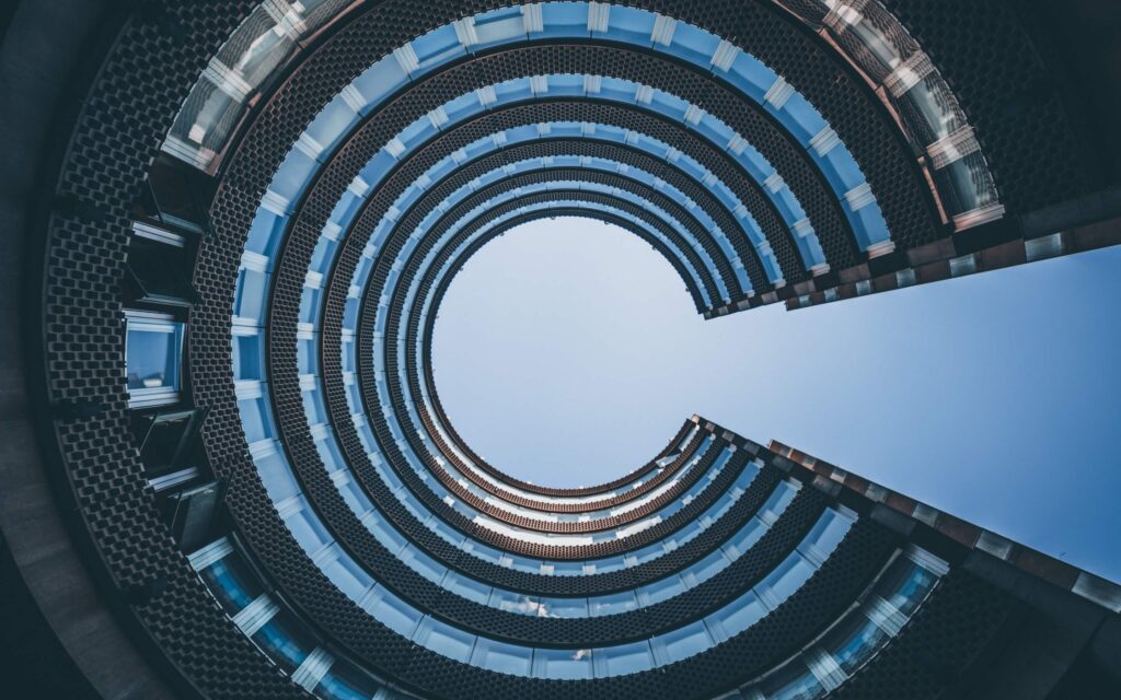 Looking up at a circule office block from the center